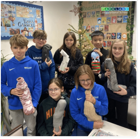 Year 6 students fully engaged in their topic ‘Fight for Your Rights’, and generously donated toiletries and sweet treats, carefully wrapping them in warm winter socks to create thoughtful and practical gifts.